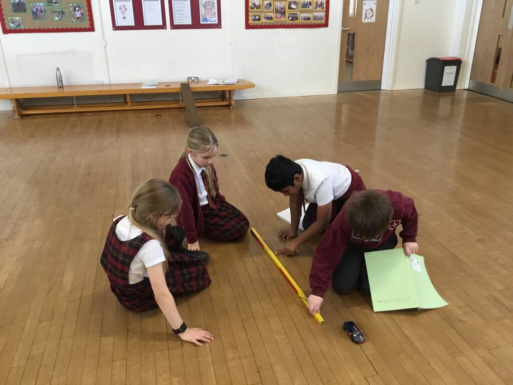 Image of Year 3 investigate the force of friction on a toy car