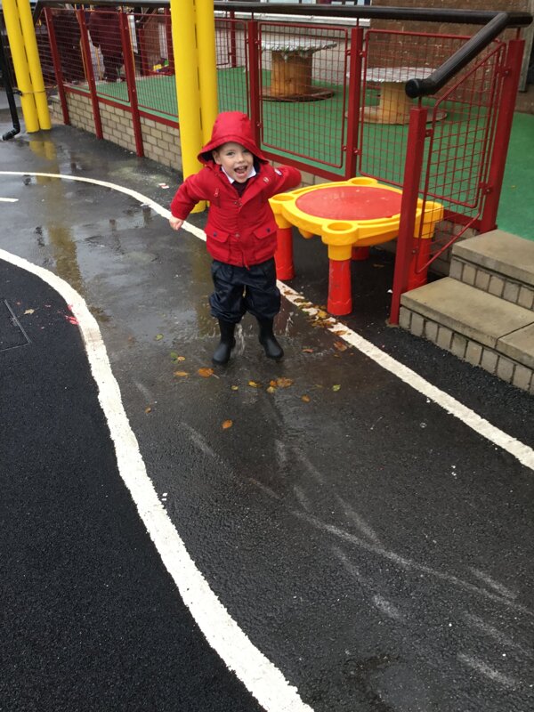 Image of Nursery out having fun in the rain!
