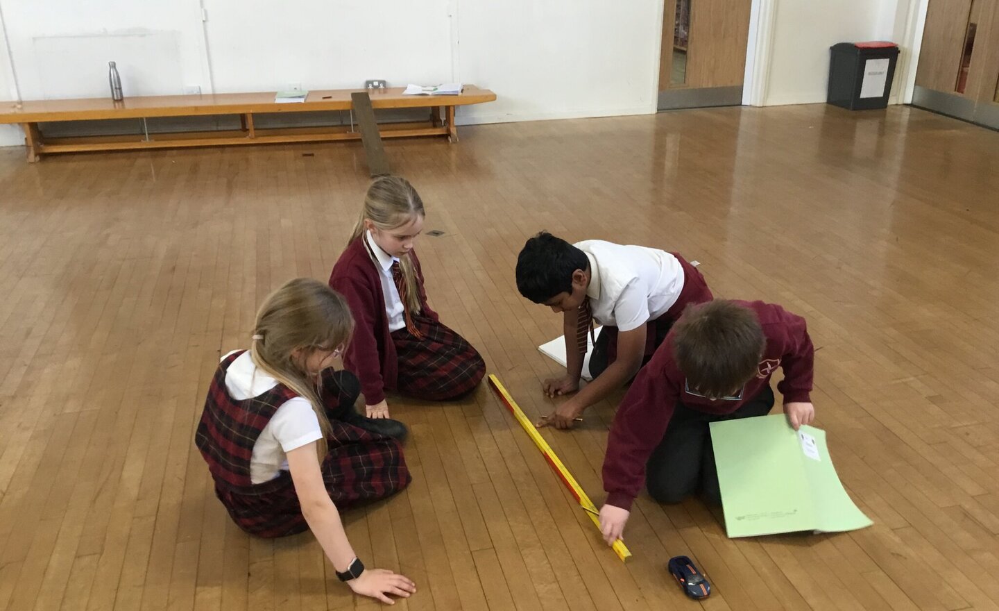 Image of Year 3 investigate the force of friction on a toy car